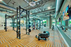 Phoenix apartment for rent - A gym with a variety of equipment including weight machines and free weights.