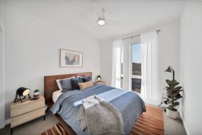 Kirkland apartment for rent - a bedroom with a bed and a large window