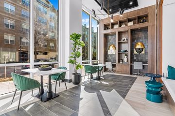 Richardson apartment for rent - A modern living room with a dining table and chairs.
