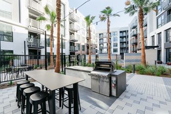 Landscaped courtyard with outdoor seating and barbecue pavilion