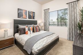 Tempe apartment for rent - our apartments offer a bedroom with a bed and a large window