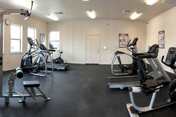 Fitness center with free weights and cardio machines