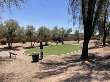 Fenced dog park with pet watering station