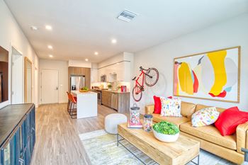 Wood-style plank flooring in kitchen and living areas