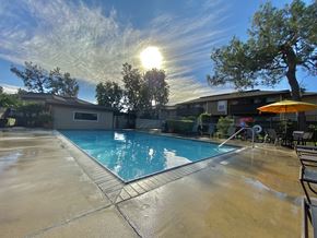 Upland apartment for rent - a swimming pool with the sun shining over it