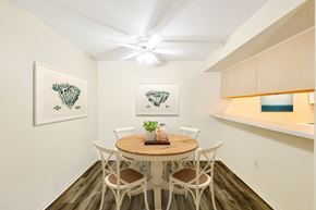 Reno apartment for rent - a dining room with a table and chairs and a ceiling fan