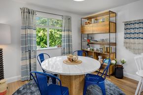 Kent apartment for rent - A dining room with a round table and blue chairs.