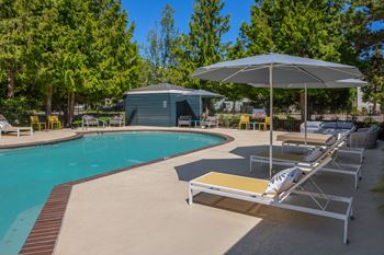 Relaxing resort-style pool with sundeck and firepit