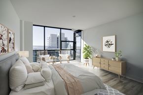 San Diego apartment for rent - a bedroom with a large bed and a large window