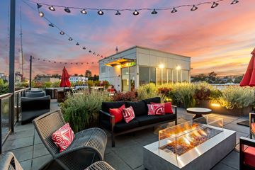 Seattle apartment for rent - A patio with a fire pit and seating area.