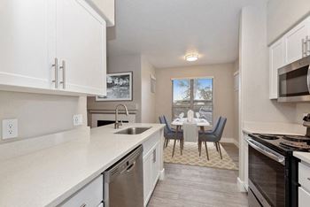 Stainless steel appliances including built-in microwave, refrigerator, and dishwasher