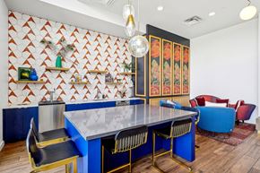 Denver apartment for rent - a dining room with a blue table and chairs