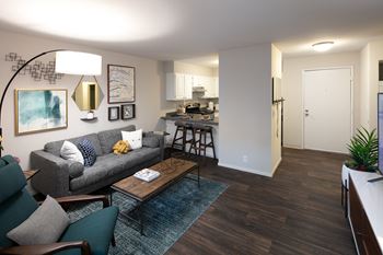 Wood-style plank flooring in kitchen and living areas