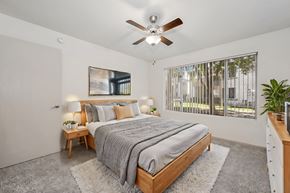 Mesa apartment for rent - a bedroom with a bed and a ceiling fan