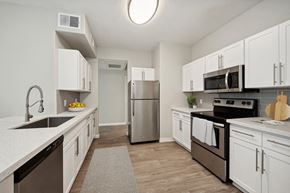Phoenix apartment for rent - a kitchen with white cabinets and stainless steel appliances