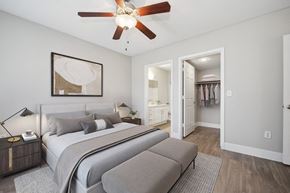 Phoenix apartment for rent - a bedroom with a large bed and a ceiling fan