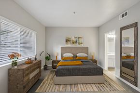 Sparks apartment for rent - a bedroom with a bed and a mirror