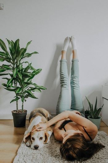 Woman on couch with dog