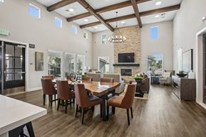 Sacramento apartment for rent - A dining room with a long table and chairs.