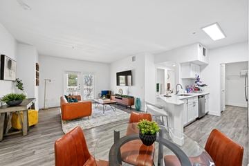 Aurora apartment for rent - A modern living room with a dining table and chairs.