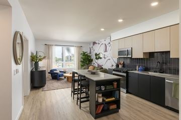Santa Clara apartment for rent - A modern kitchen with a dining table and chairs.