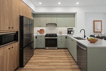 Los Angeles apartment for rent - A modern kitchen with wooden cabinets and stainless steel appliances.