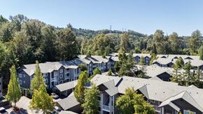 Renton apartment for rent - A large housing development with a forest in the background.
