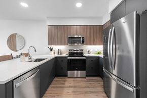 Hillsboro townhouse for rent - Dark Designer Scheme Model Flat Kitchen - Savanna at Reed's Crossing