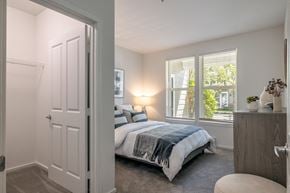 Mukilteo apartment for rent - a bedroom with a bed and two windows