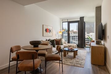 San Diego apartment for rent - A living room with a table and chairs.