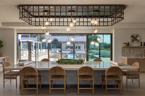 Huntington Beach apartment for rent - A modern dining room with a large table and chairs.