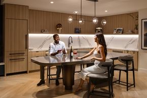 Long Beach apartment for rent - Two people sitting at a table in a modern kitchen.