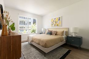 San Diego apartment for rent - a bedroom with a large bed and two windows