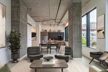 Seattle apartment for rent - A modern living room with a grey sofa set and a coffee table.