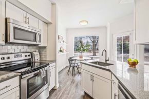 Centennial apartment for rent - A modern kitchen with a stainless steel oven and microwave.