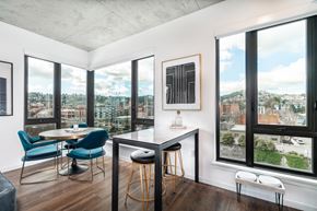 Portland apartment for rent - A modern kitchen with a table and chairs.