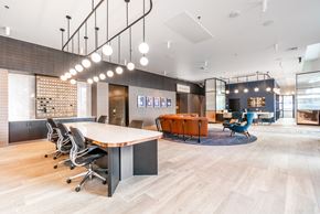 Portland apartment for rent - A conference room with a long table, chairs, and a fireplace.