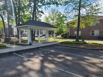 North Charleston apartment for rent - A gazebo is situated in the middle of a parking lot.