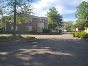 North Charleston apartment for rent - a large brick apartment building with a street in front of it