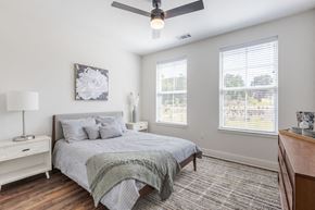 Seneca apartment for rent - a bedroom with a bed and a ceiling fan