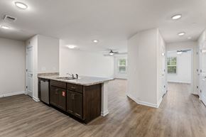 Greenville apartment for rent - A kitchen with a counter and cabinets.