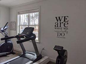 Charlotte apartment for rent - a gym with a exercise bike in a room with a window