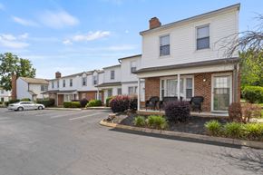 Greenville apartment for rent - A row of houses with a car parked in front of them.