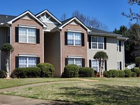 Inman apartment for rent - a large brick house with a sidewalk in front of it