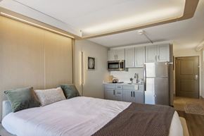 Greenville apartment for rent - Greenville, SC Studios For Rent | Flathouse Studios | Bedroom with Ori Expandable Bed, Pocket Closet, and Large Window.
