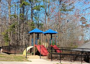 York apartment for rent - a playground with a swing set and slides