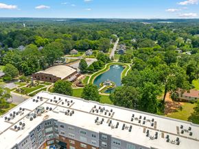 Greer apartment for rent - A bird's eye view of a resort with a pool and a building with a lot of windows.