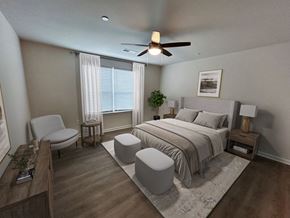 Greenville apartment for rent - A bedroom with a bed, chair, and window.