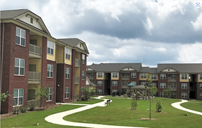 Camden apartment for rent - an exterior view of an apartment complex with a green yard