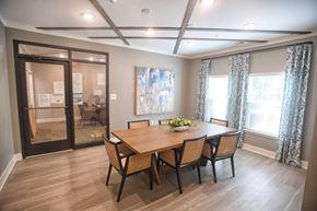 Greenville apartment for rent - A dining room with a wooden table and chairs.